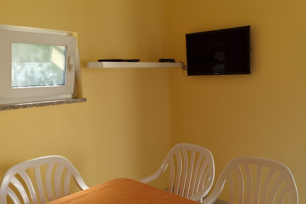 Indoor dining room with TV